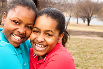 Fototapeta premium African American sisters and best friends laughing.