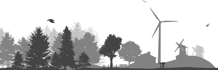 grey windmill and country house near forest