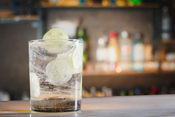 Gin tonic cocktail with cucumber.