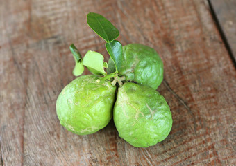 bergamot fruit with leaf on wood table