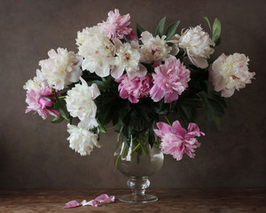 a bouquet of white and pink peonies