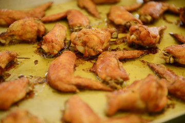 Ali di pollo cottura al forno a legna