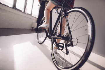 Fototapeta na wymiar partial view of stylish woman riding sports bicycle