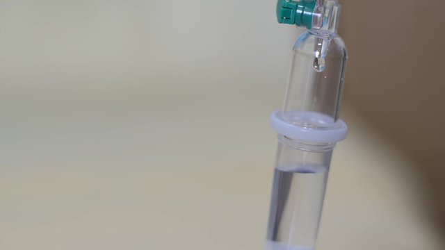 Close up saline intravenous drip for patient.
