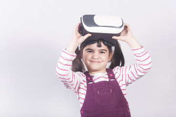 Cute little girl with virtual reality headset
