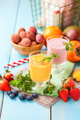 Orange persimmon blueberry smoothie   and fruits. Selective focus. Copy space. Top view