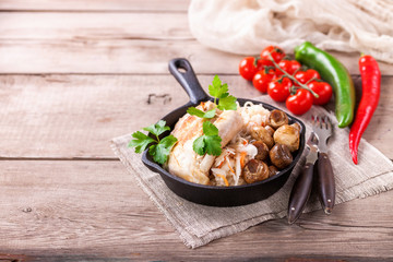 Chicken fillet, cabbage and mushrooms lunch. Selective focus. Copy space.