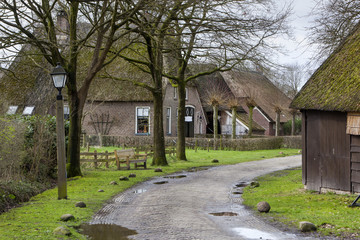 Street with historic farms en barns in Orvelte