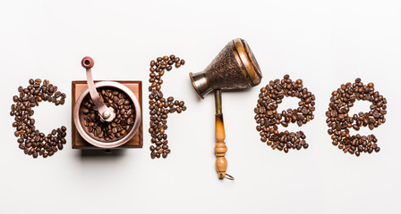 Top view of word coffee made from coffee beans and coffee mill with turkish coffee pot