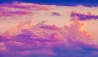 Evening morning sky with fluffy clouds of soft pastel tones. Nature background, wallpaper.