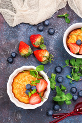 Berries cottage cheese casserole. Selective focus. Top view. Copy space