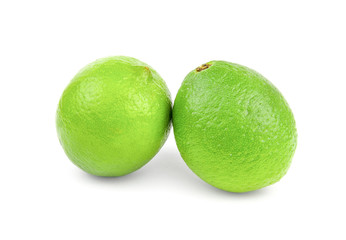 Two juicy lime isolated on white background cutout