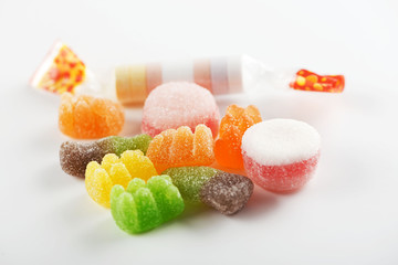 Candies of various flavors and colors on white background. Horizontal shoot.