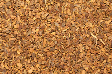 Dried Organic True Cinnamon (Cinnamomum verum) for Tea. Macro closeup background texture. Top view.