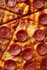 Pepperoni pizza. Hot homemade food. Sliced fresh italian classic salami pizza. Popular topping with cheese. Baked meal.