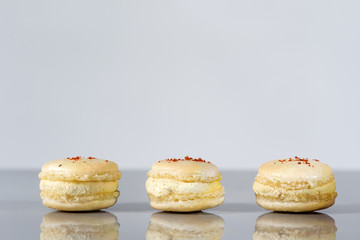 French cheese macaroons with safron on the top