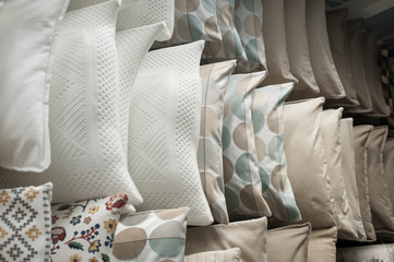 set of pillows on the shelves in the closet