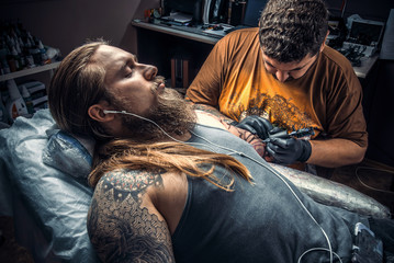 Fototapeta premium Professional tattooist posing in studio