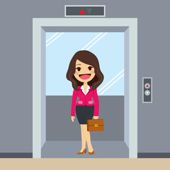 Young happy businesswoman using elevator at office © Kakigori Studio