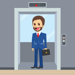 Young happy businessman using elevator at office © Kakigori Studio