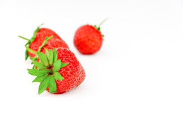 Ripe strawberry on white background.