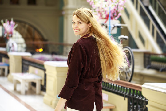 Young beautiful blonde woman in a corduroy jacket