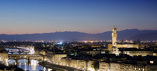 Aerial panorama of Florence city, Arno River and Ponte Vecchio at sunset.