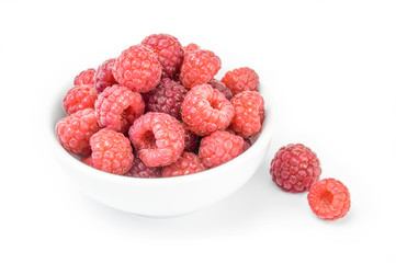 Raspberries in a bowl isolated on white background cutout