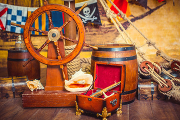 Decoration of the room in a pirate style, with a helm and a treasure chest