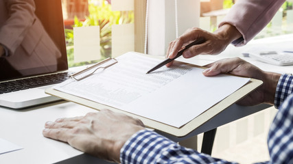 Team work process. young business managers crew working with new startup project. labtop on wood table, typing keyboard, texting message, analyse graph plans.