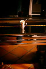 a coffee on a piano