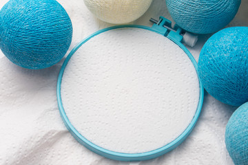 Embroidery hoop with blank fabric and christmas balls decoration