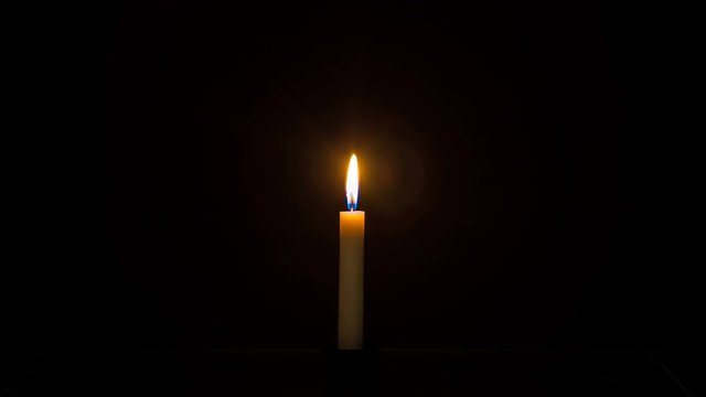 Complete burning of the candle from start to finish in the dark, Timelapse, 4K footage