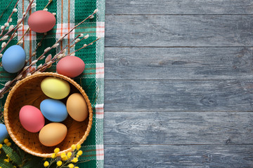 Colorful easter eggs on wood background