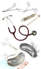 High angle shot of a group of medical / surgical instruments and tools including scalpels, forceps and stethoscope on white background