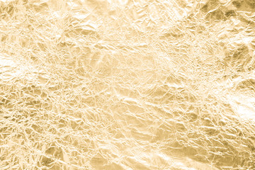 Gold wrinkled paper texture abstract background