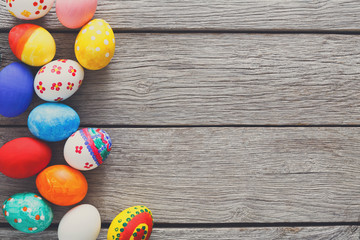 Colorful easter eggs on wood background