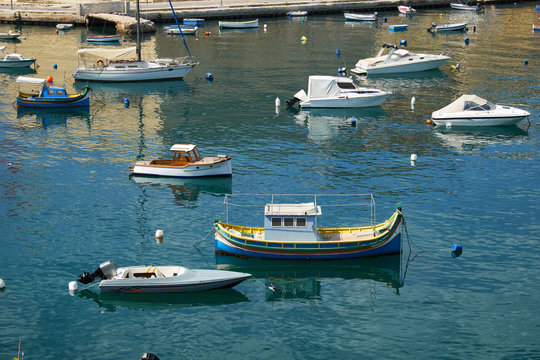 The yachts and boats moored in the harbor. Malta