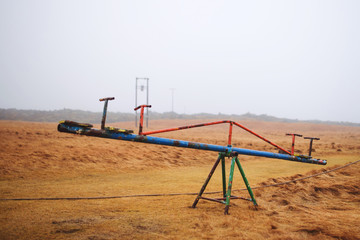 Fototapeta premium Old Seesaw in Field