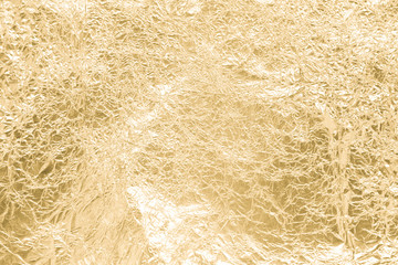 Gold wrinkled paper texture abstract background