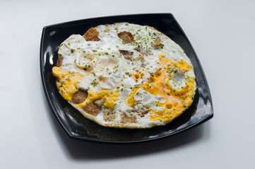 fried eggs with toasts and chopped  parsley