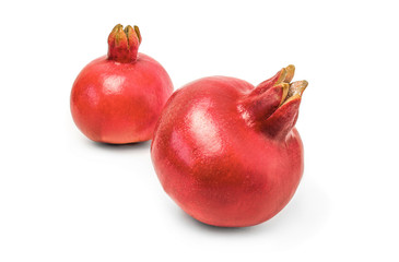 Two whole pomegranates isolated on white background cutout