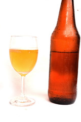 whiskey bottle and glass on isolated white