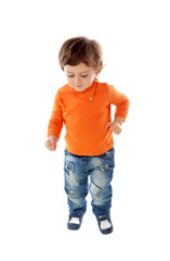 Beautiful little child two years old wearing jeans and orange jersey