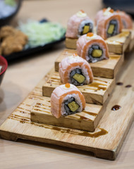 Japanese sushi on a wooden plate