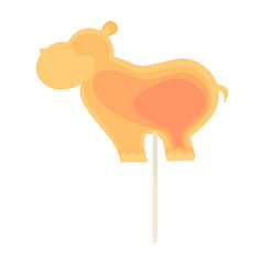 Caramel candy on a stick in the form of a large hippopotamus. For children on holidays.