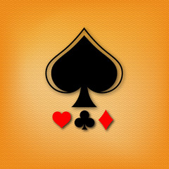 Design for poker and casino. The spades suit of a deck of cards with a diamonds, a clubs and a hearts on a yellow background with a pattern and a realistic shadow