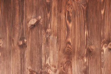 Dark brown scratched wooden cutting board. Wood texture