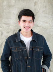 Closeup Asian man casual outfits standing in jeans and black denim shirt, men black hair and short hair, smiling and wearing jeans jacket, beauty and fashion concept, and Jeans concept