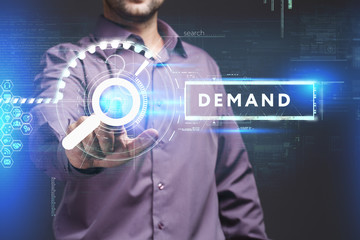 Business, Technology, Internet and network concept. Young businessman working on a virtual screen of the future and sees the inscription: Demand